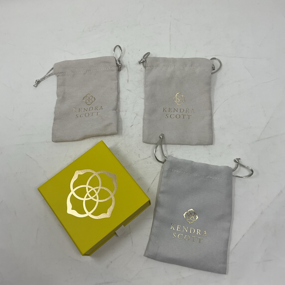 Kendra Scott Gray Pouches with Yellow Box